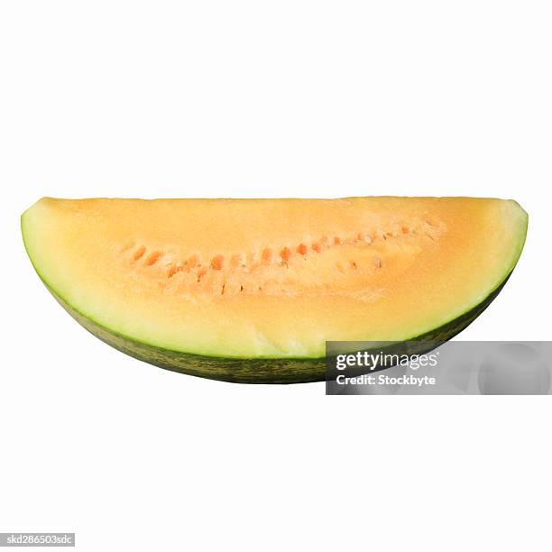 close-up of a slice of yellow watermelon - slice stock pictures, royalty-free photos & images