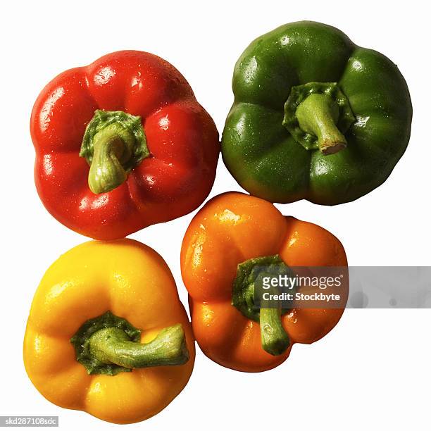 close-up of bell peppers - orangefarbige paprika stock-fotos und bilder