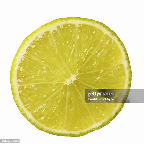 close-up of a slice of lime - slice stock pictures, royalty-free photos & images