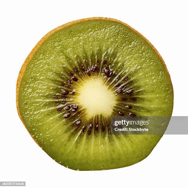 close-up of a slice of kiwi - slice stock pictures, royalty-free photos & images