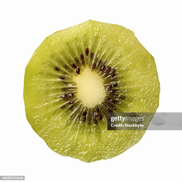 close-up of a slice of skinless kiwi - slice stock pictures, royalty-free photos & images