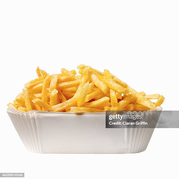 close-up of a carton of french-fries - french fries white background stock-fotos und bilder