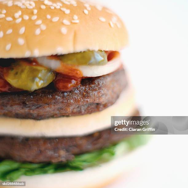 close-up of double decker burger - decker stock pictures, royalty-free photos & images