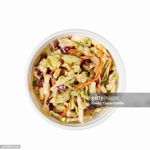 close-up of container of coleslaw - coleslaw stock pictures, royalty-free photos & images