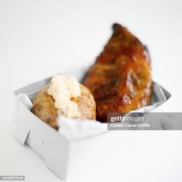 close-up of a carton of mashed potato and spare ribs - mashed stock pictures, royalty-free photos & images