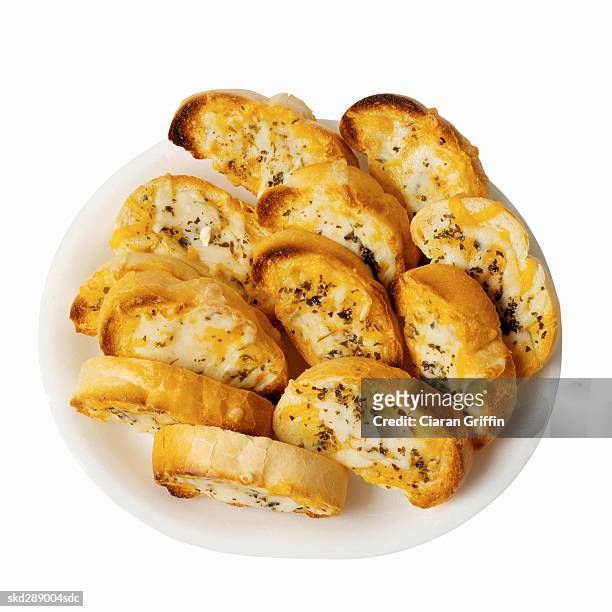 close-up of a dish of garlic bread with cheese - garlic bread stock pictures, royalty-free photos & images