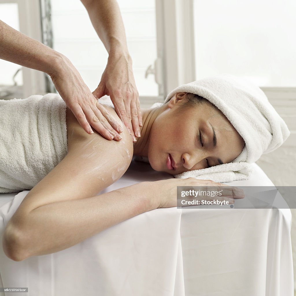 Portrait of a young woman getting a massage