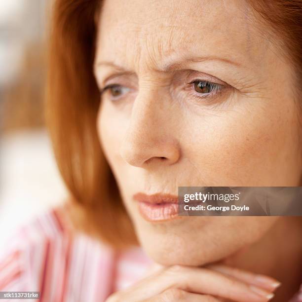 close-up of an elderly woman looking ahead - ahead stock pictures, royalty-free photos & images