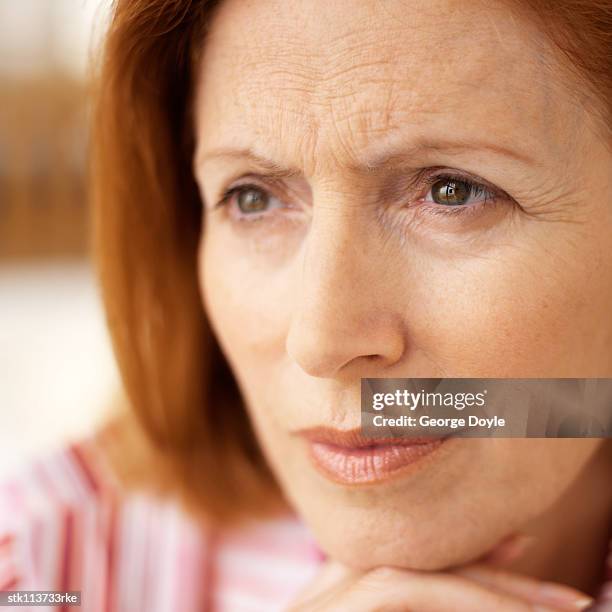 close-up of an elderly woman looking ahead - get ahead stock-fotos und bilder