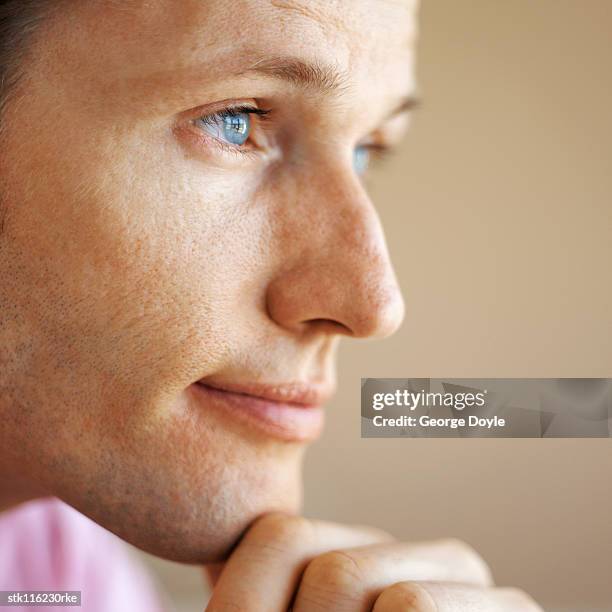 close-up side profile of a young businessman looking ahead - ahead stock pictures, royalty-free photos & images