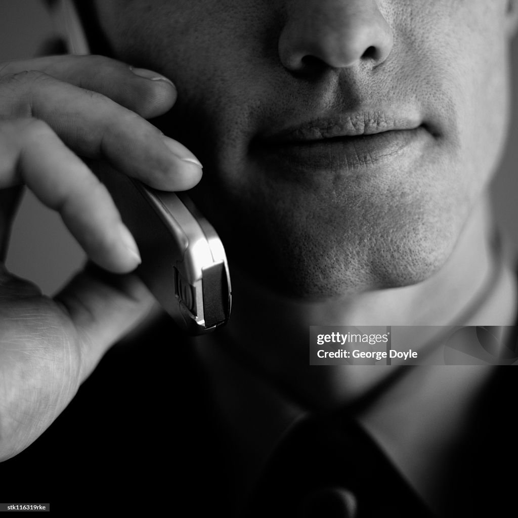 Close-up of a young businessman talking on a mobile phone