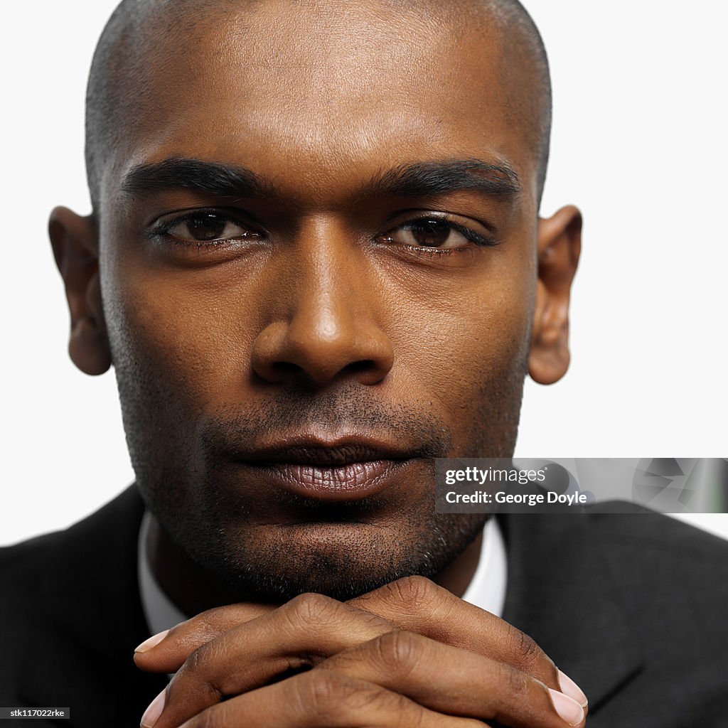 Close-up of a young businessman looking at camera