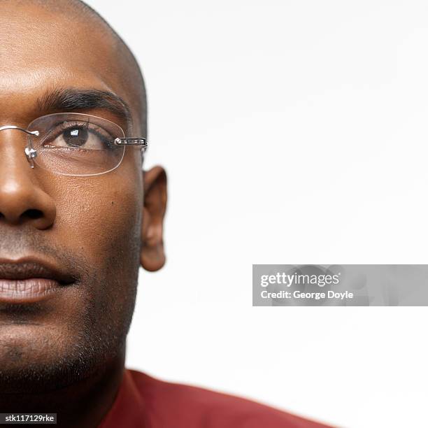 close-up of a young businessman looking ahead - ahead stock pictures, royalty-free photos & images