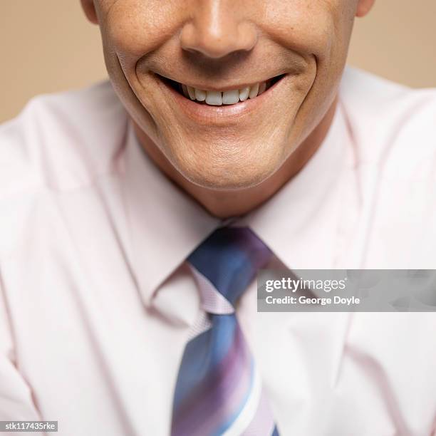 close-up of a young businessman's smile - smile imagens e fotografias de stock