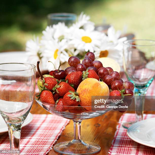 close-up of a basket of assorted fruit served on a table - temperate flower stockfoto's en -beelden