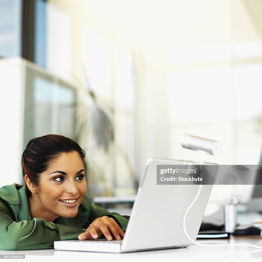 Close up of a businesswoman in video conference using laptop