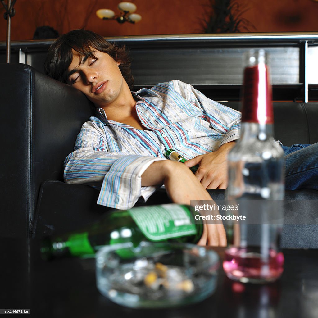 Portrait of a young man passed out on the couch