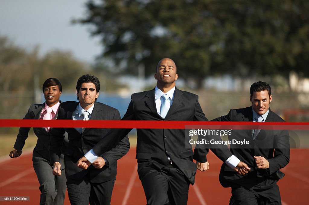 Business executives running in a race