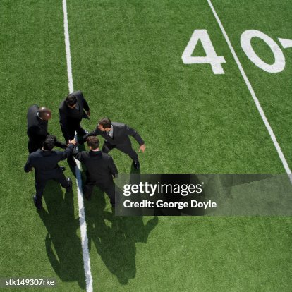 Huddle Top View High Angle View Of Businessmen In A Huddle On A Football Field High-Res ...