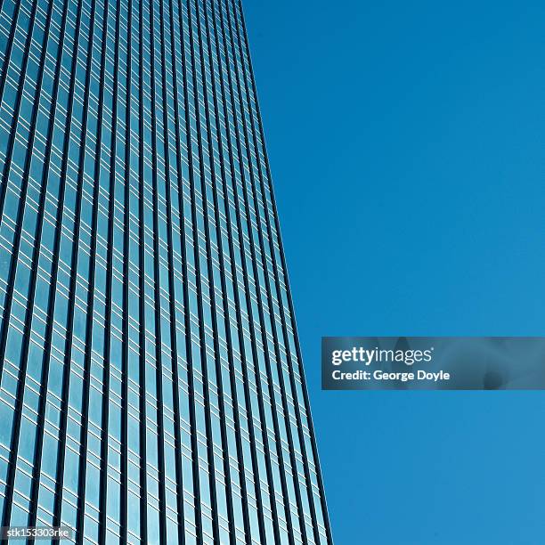 low angle view of a high rise office building - high rise film stock-fotos und bilder