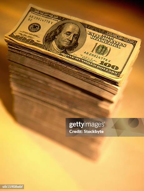 close-up of a stack of hundred dollar bills - stack foto e immagini stock