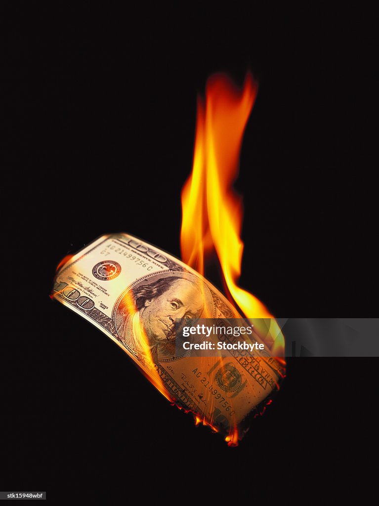 Close-up of currency burning