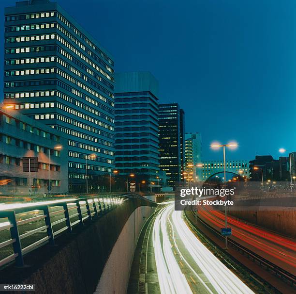 high angle time lapse view of traffic movement on a highway - time lapse stock-fotos und bilder