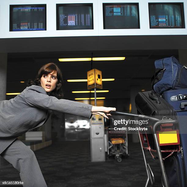 businesswoman struggling with baggage - the challenge stock pictures, royalty-free photos & images