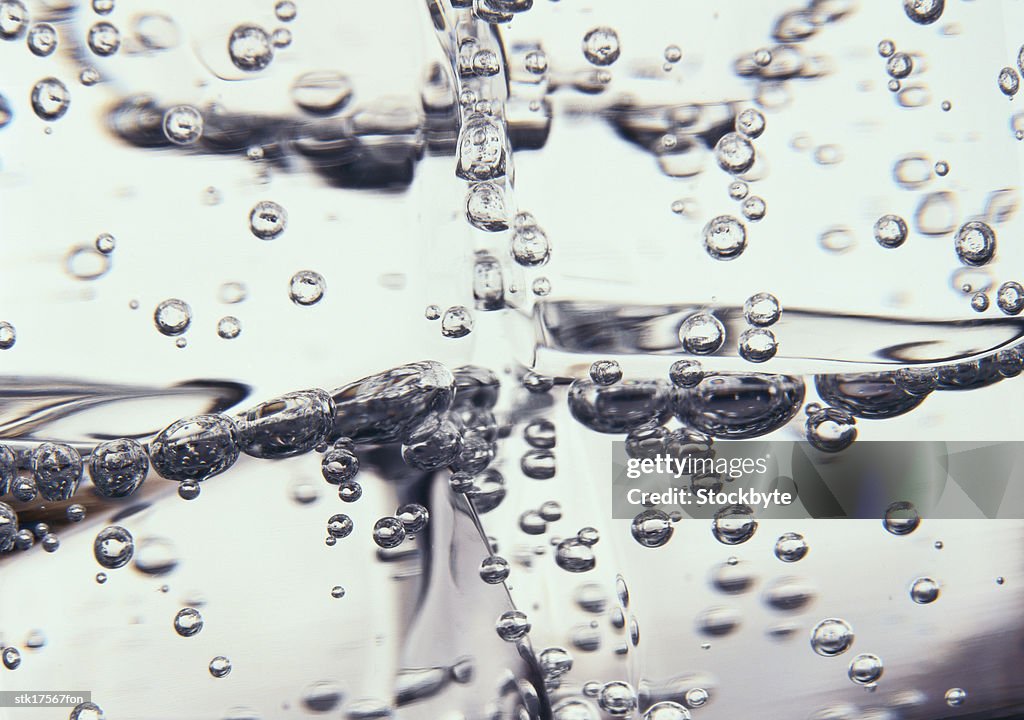 Close-up of bubbles in a glass of liquid