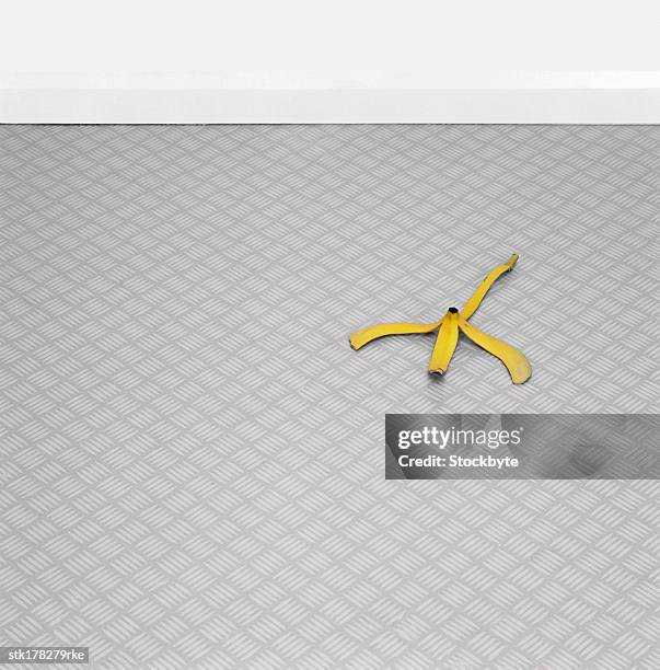 a banana peel lying on the floor - super sensory stock pictures, royalty-free photos & images