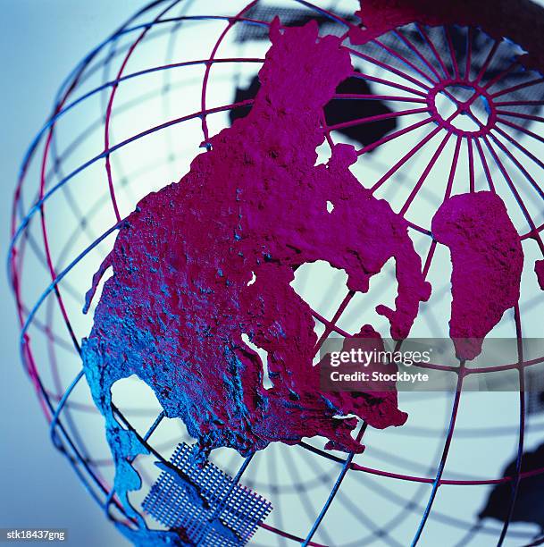 high angle close-up of a mesh globe with patches of land - high up ストックフォトと画像