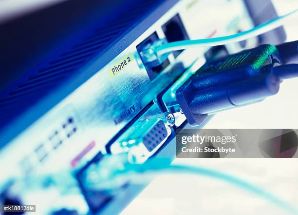 close-up of a cable inserted into the back of a disk drive - disk drive stock pictures, royalty-free photos & images