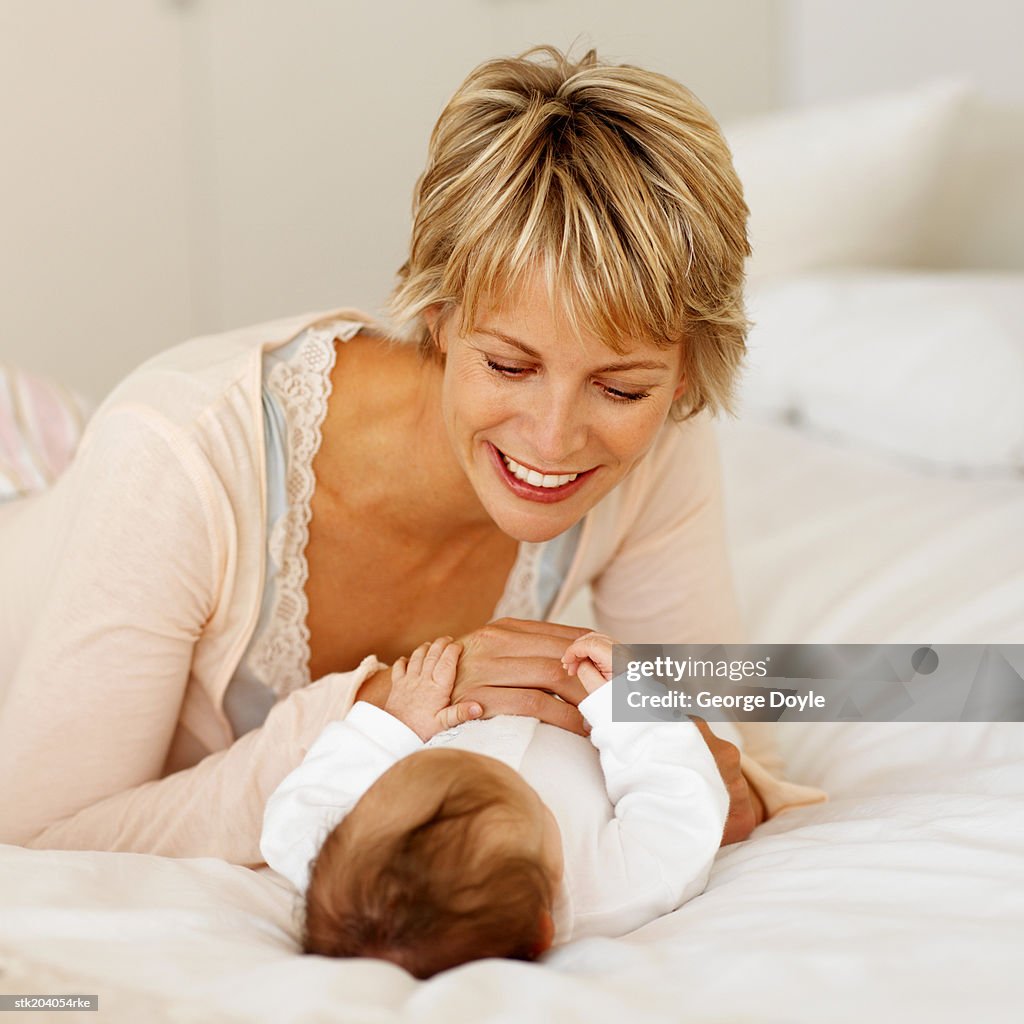 Mother playing with baby (6-12 months)