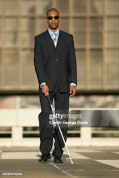 Blind Man Walking With The Aid Of A White Stick High-Res Blind Man Walking With The Aid Of A White Stick High-Res
