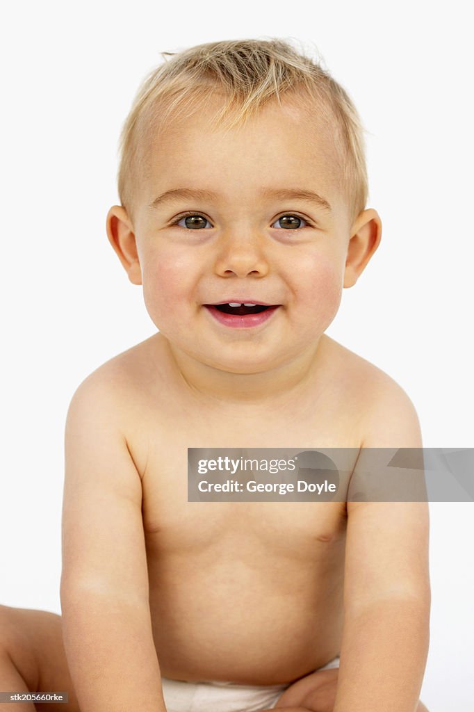 Close up portrait of a baby (12-18 months) laughing