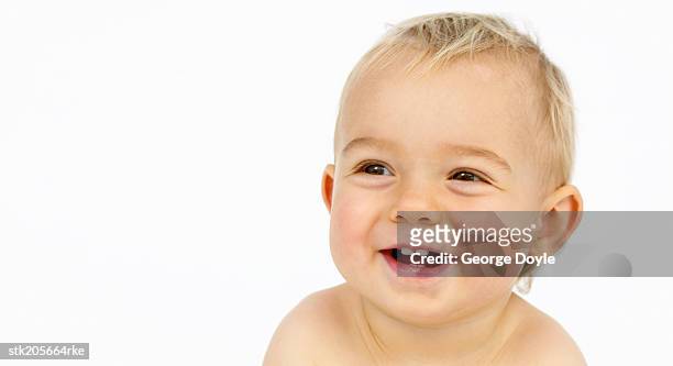close up view of a baby (12-18 months) laughing - only baby boys stock pictures, royalty-free photos & images