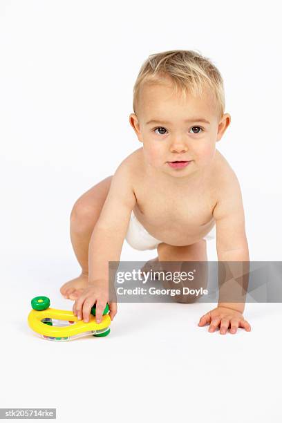 baby (12-18 months) playing with a toy - only baby boys stock pictures, royalty-free photos & images