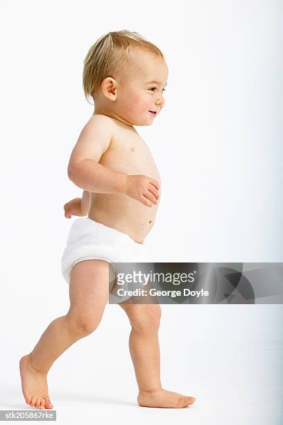 side view of a baby (18-24 months) running - only baby boys stock pictures, royalty-free photos & images