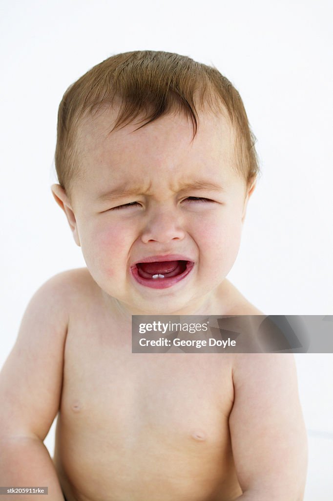 Close up view of a baby (12-18 months) crying
