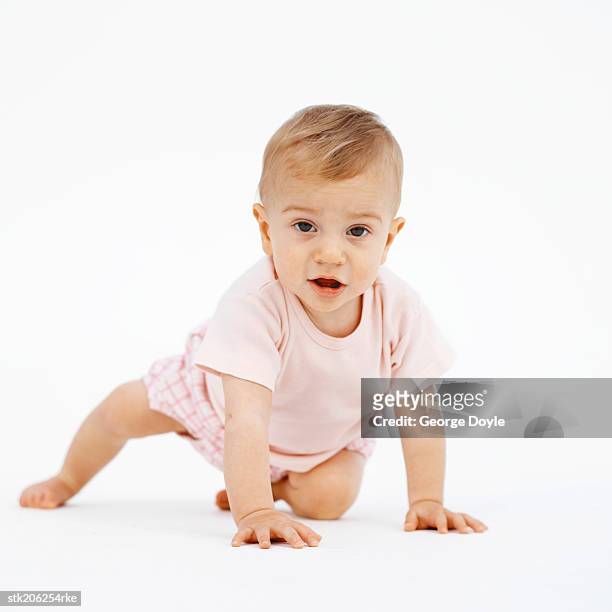 baby (12-18 months) trying to stand - only baby girls stock pictures, royalty-free photos & images