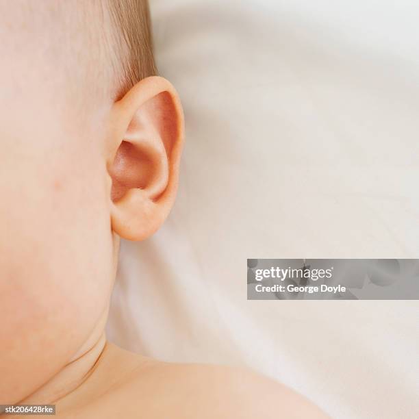 close up view of a the side of a baby's head - only baby boys stock pictures, royalty-free photos & images