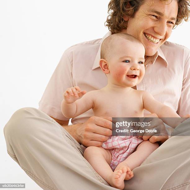 father spending time with his baby (12-18 months) - genderblend stock-fotos und bilder