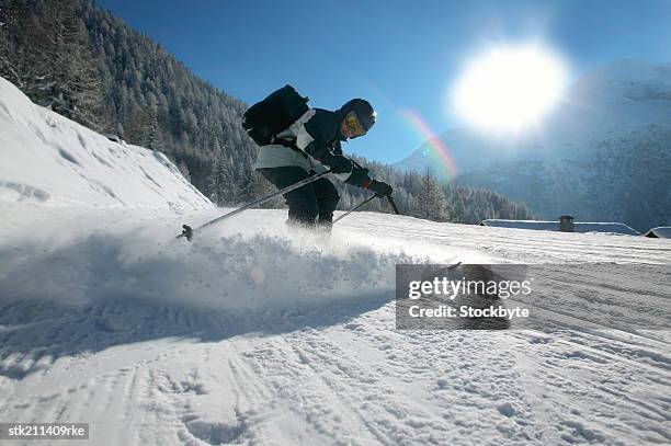 close up of skier coming down a slope in french alps - people coming of age purify with icy water in tokyo stockfoto's en -beelden