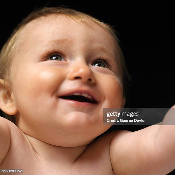 close up view of a baby girl (6-12 months) smiling - only baby boys stock pictures, royalty-free photos & images