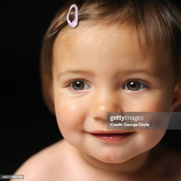 close up view of a baby girl (6-12 months) smiling - only baby girls stock pictures, royalty-free photos & images