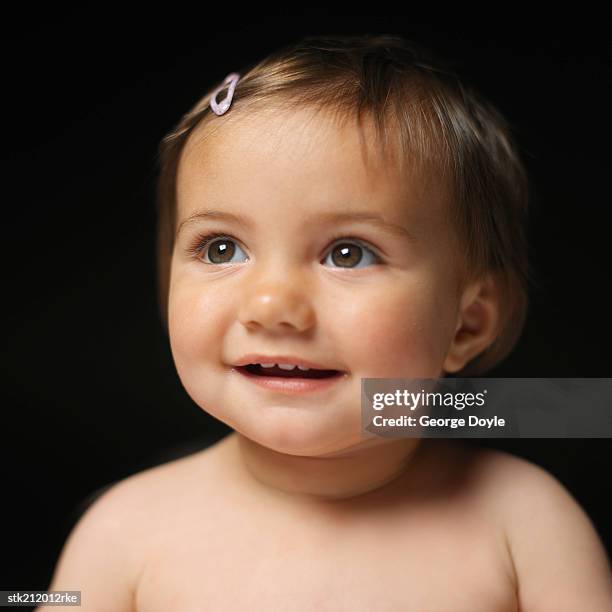 close up view of a baby girl (6-12 months) smiling - only baby girls stock pictures, royalty-free photos & images