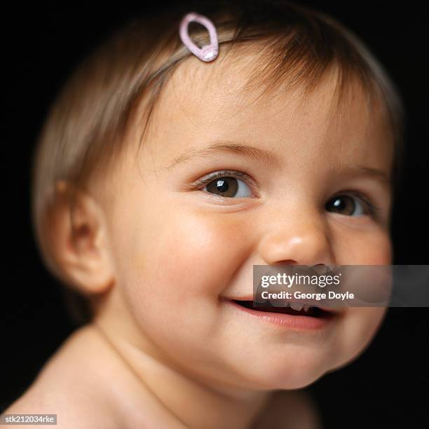 close up view of a baby girl (6-12 months) smiling - only baby girls stock pictures, royalty-free photos & images