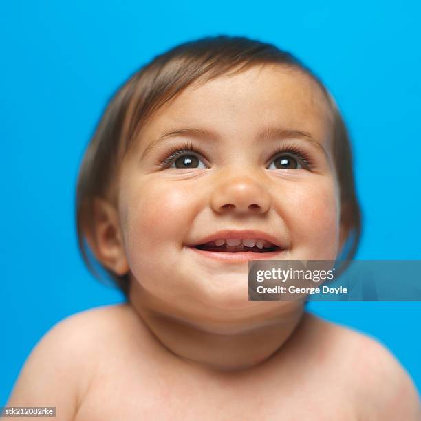 close up view of a baby girl (6-12 months) smiling - only baby girls stock pictures, royalty-free photos & images