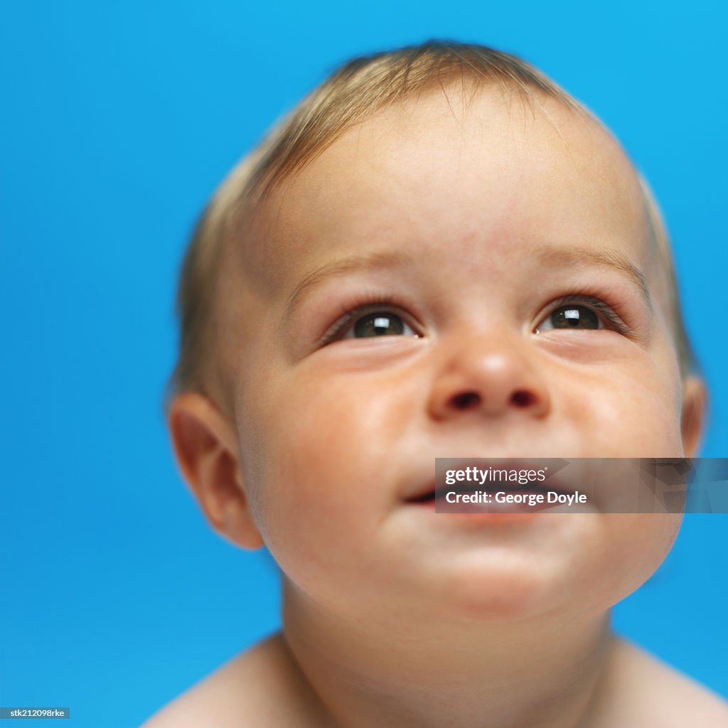Close up view of a baby girl (6-12 months) smiling