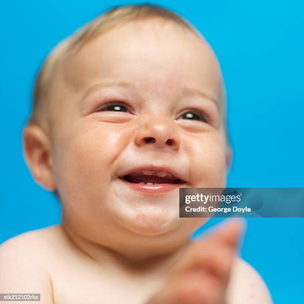 close up view of a baby girl (6-12 months) smiling - only baby boys stock pictures, royalty-free photos & images